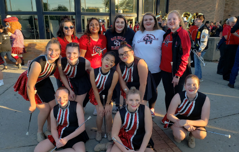 Majorettes and grads in front of commons